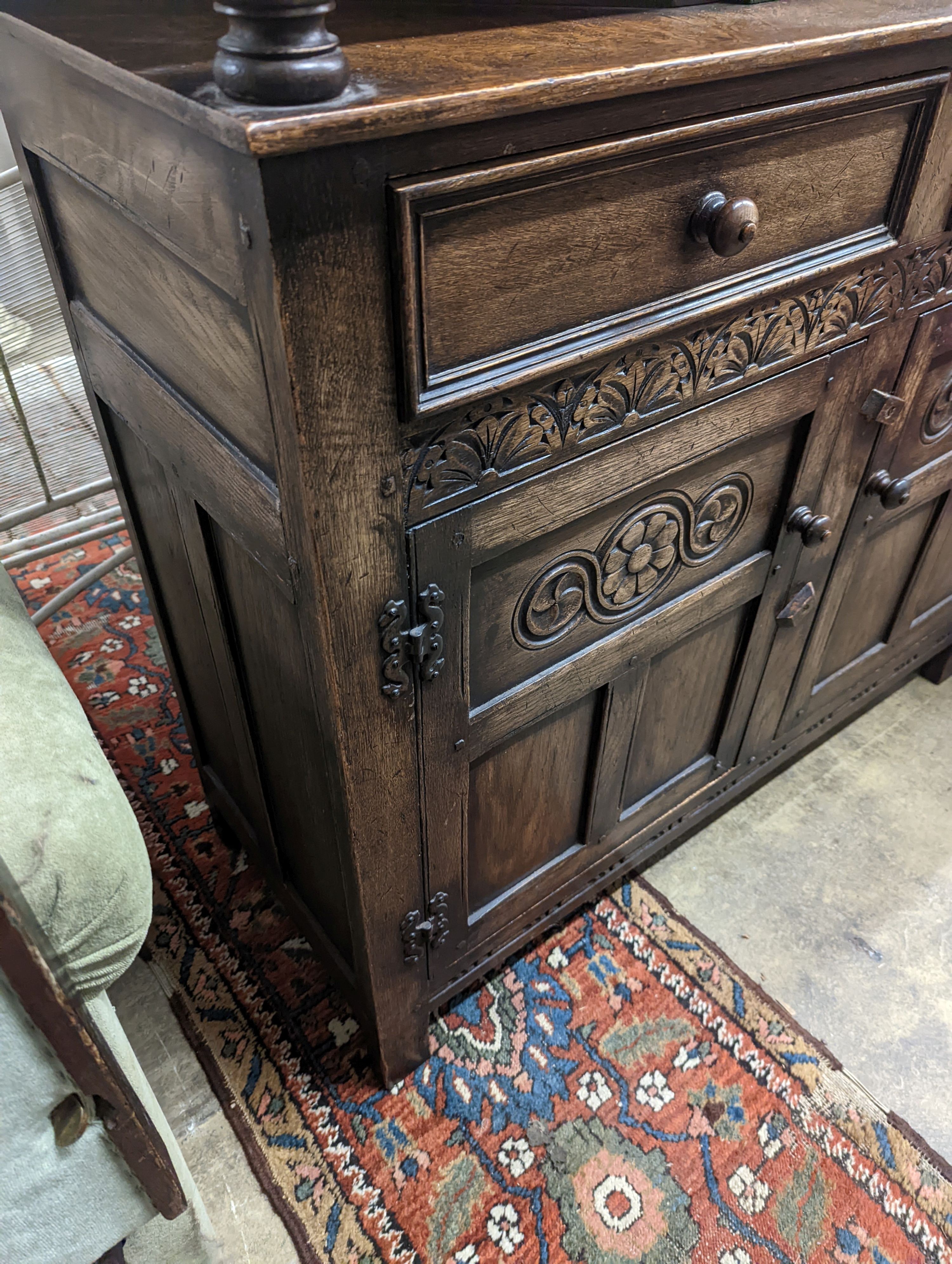 An 18th century style oak court cupboard, length 108cm, depth 43cm, height 128cm